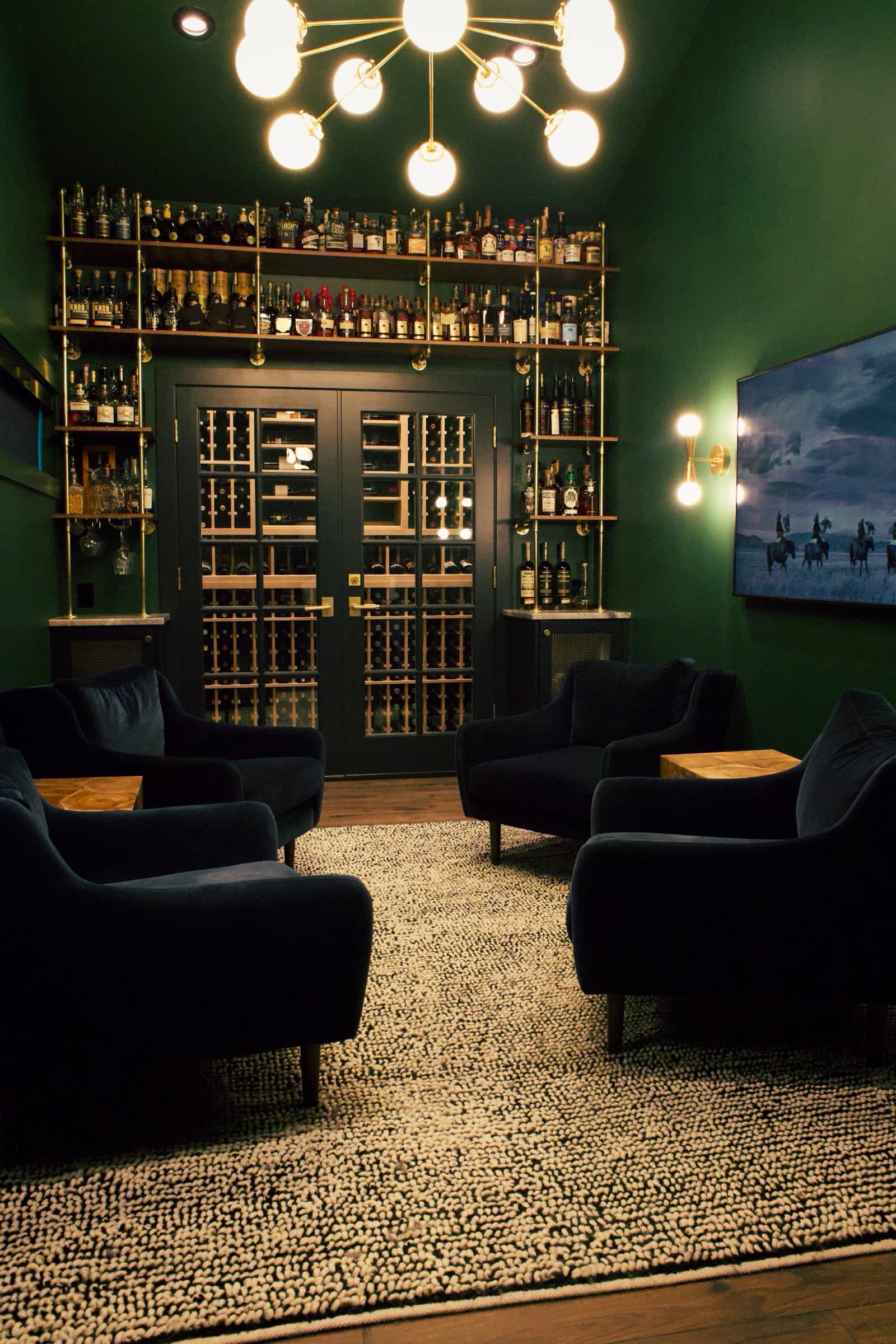 The Casner Park lounge — velvet chairs, chandelier, and the collection