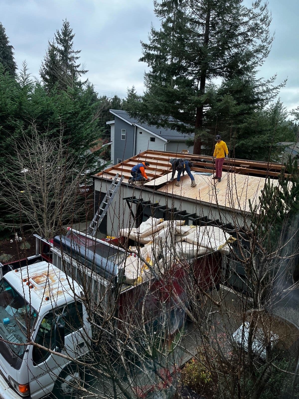 Exterior view of roof reconstruction in progress