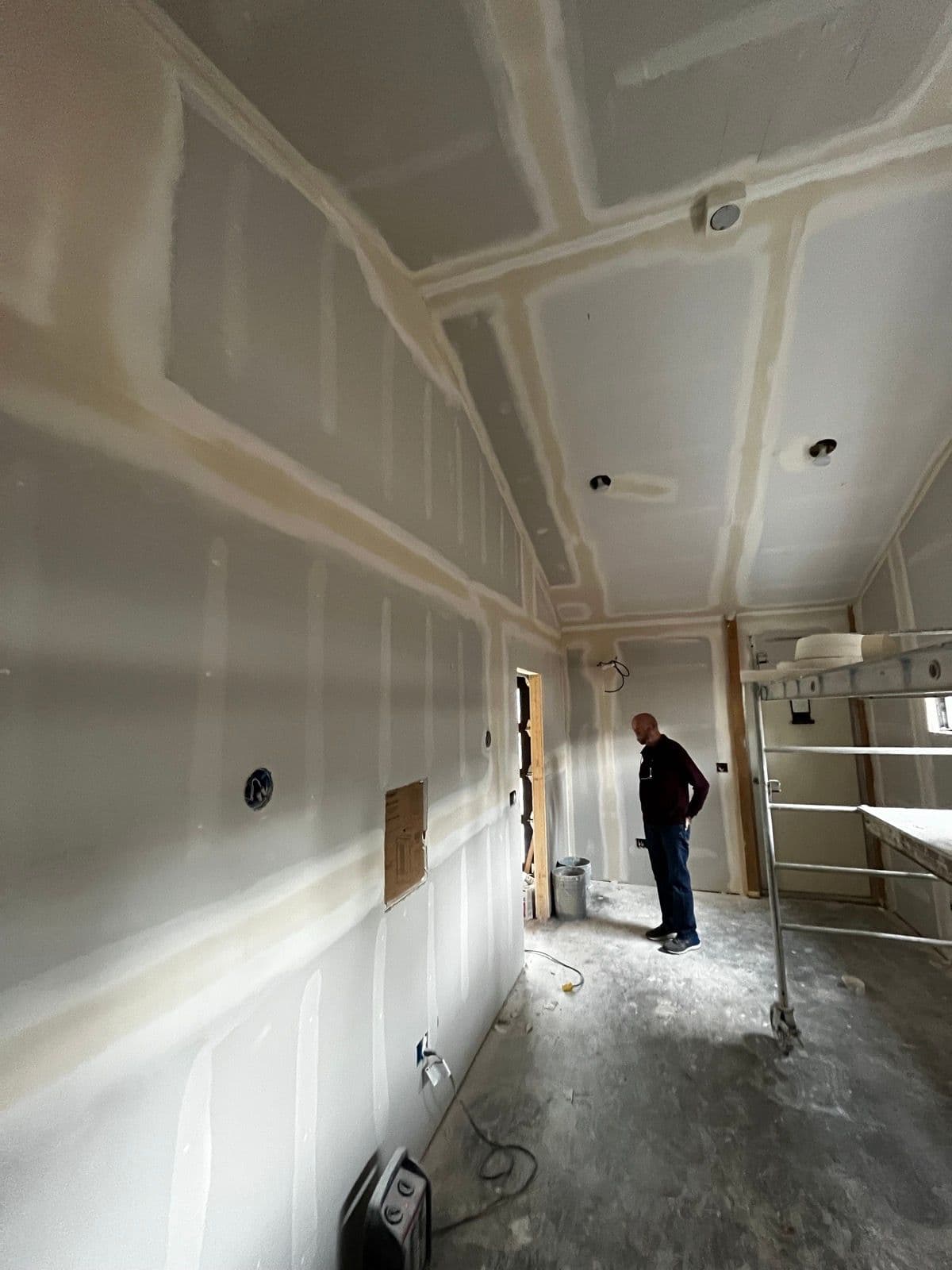 Drywall mudding and taping in progress