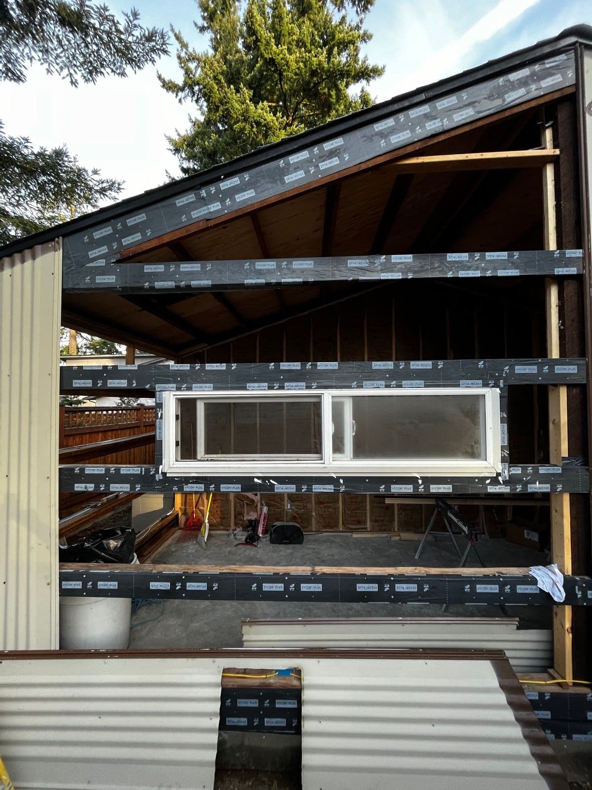 New window framing with house wrap on the exterior wall