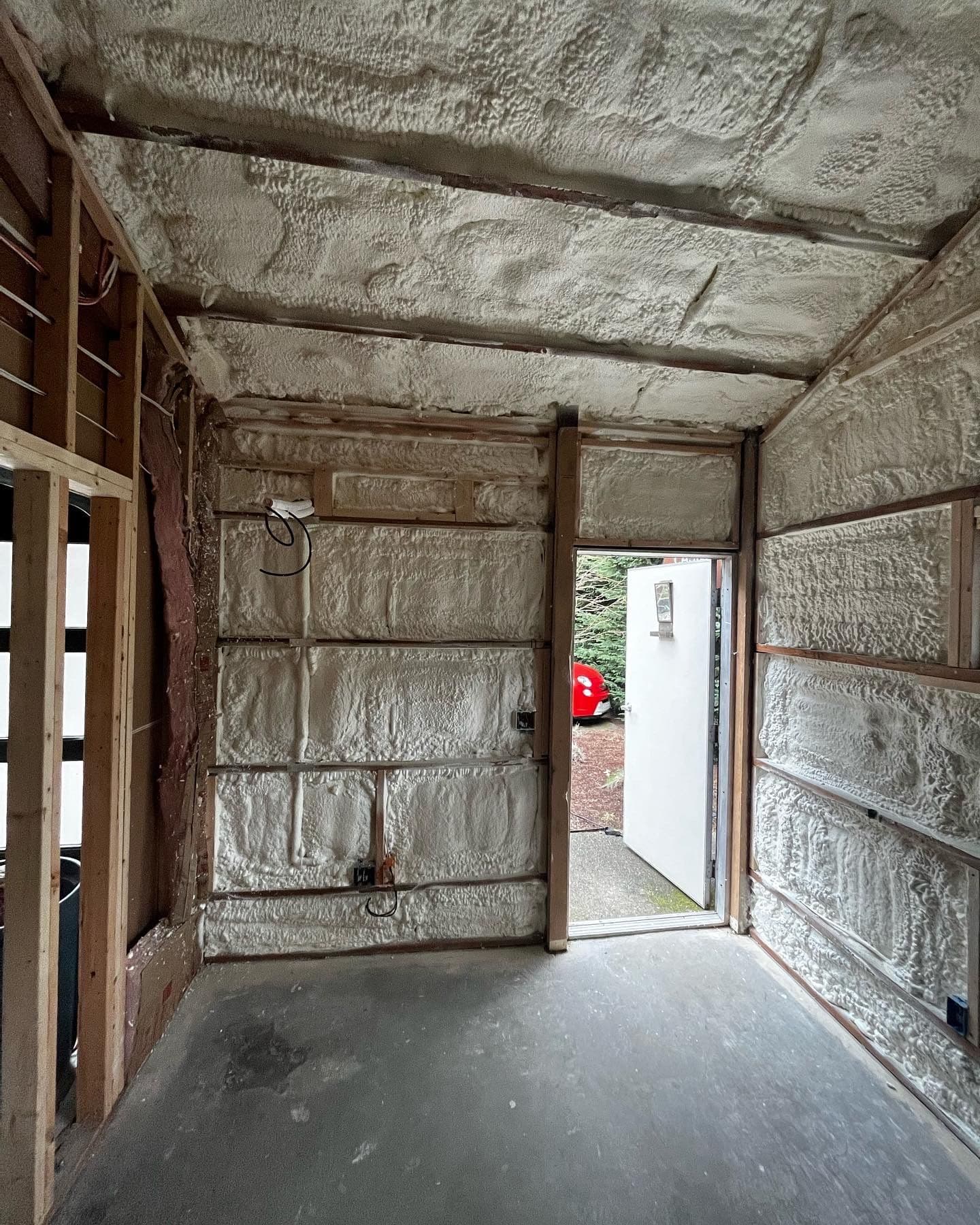 Spray foam insulation covering walls and ceiling