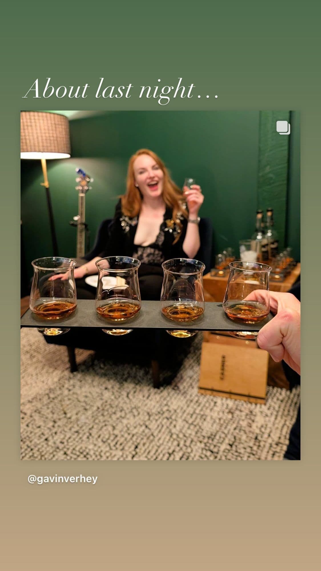 Laughing while being served a whiskey flight in the velvet chairs