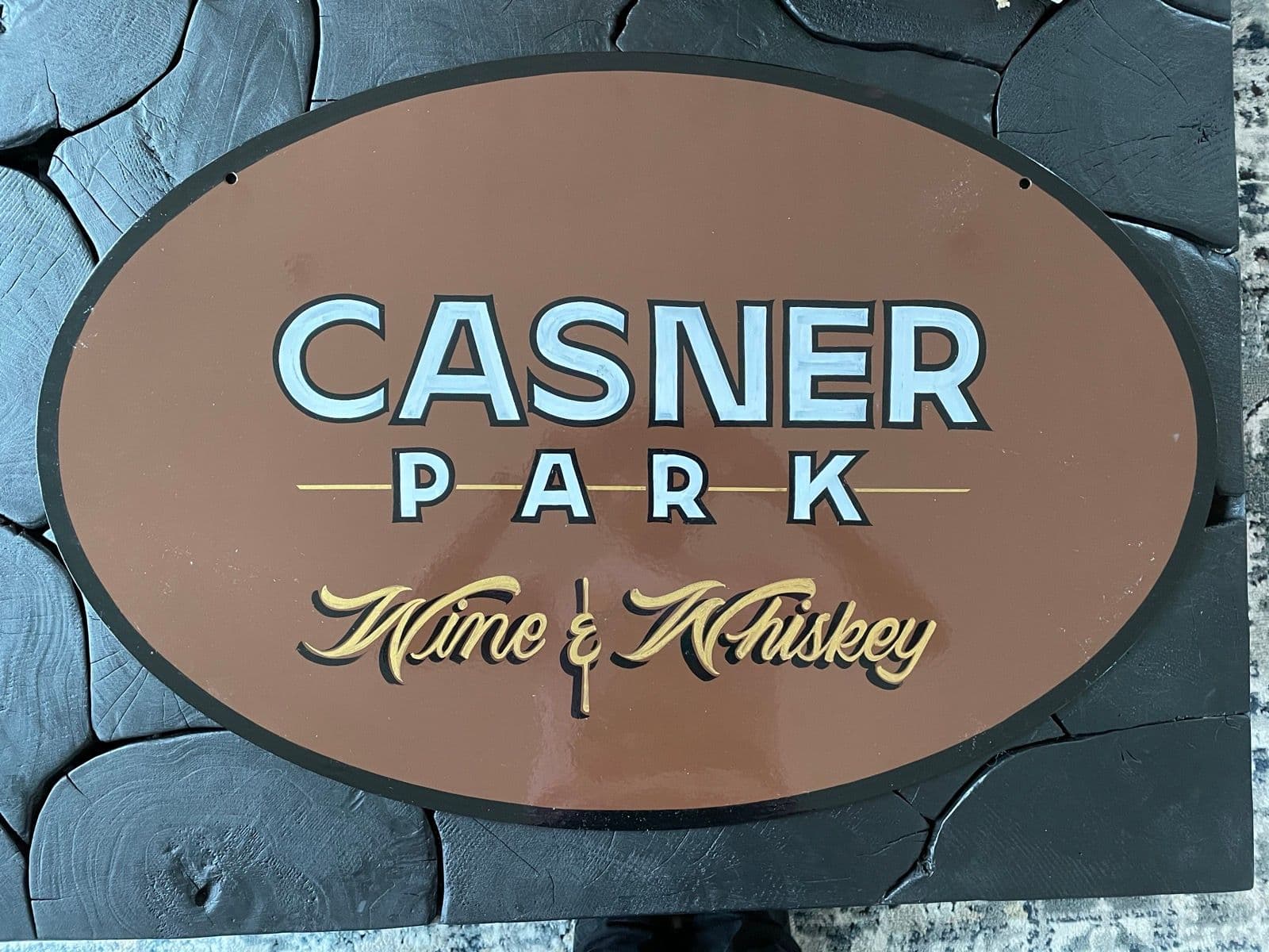 The finished Casner Park Wine & Whiskey sign