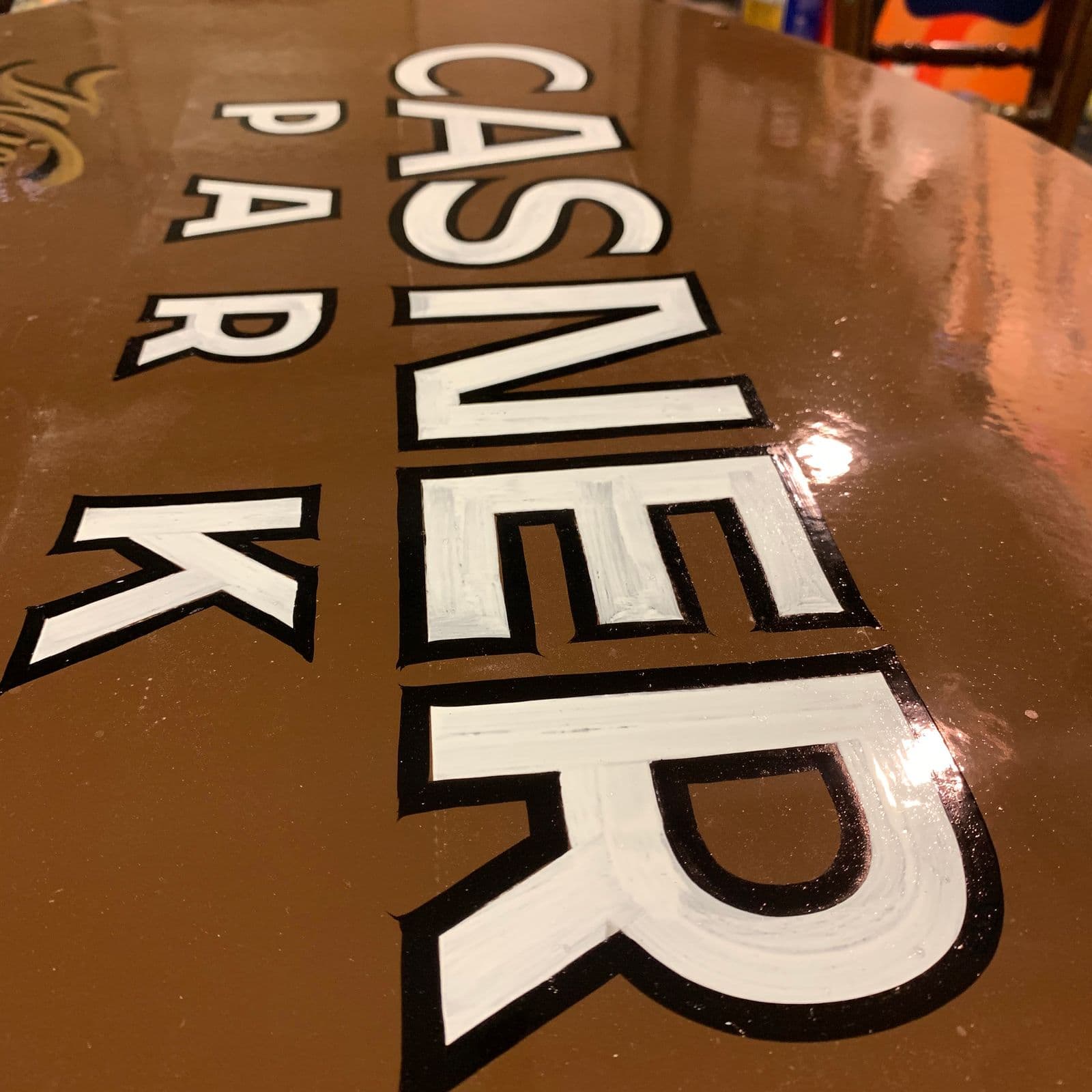 Close-up of the hand-painted Casner Park lettering in progress