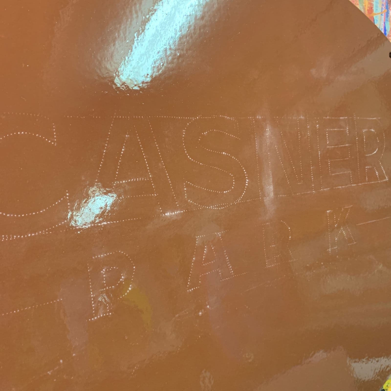 The sign stenciled on the raw surface before painting